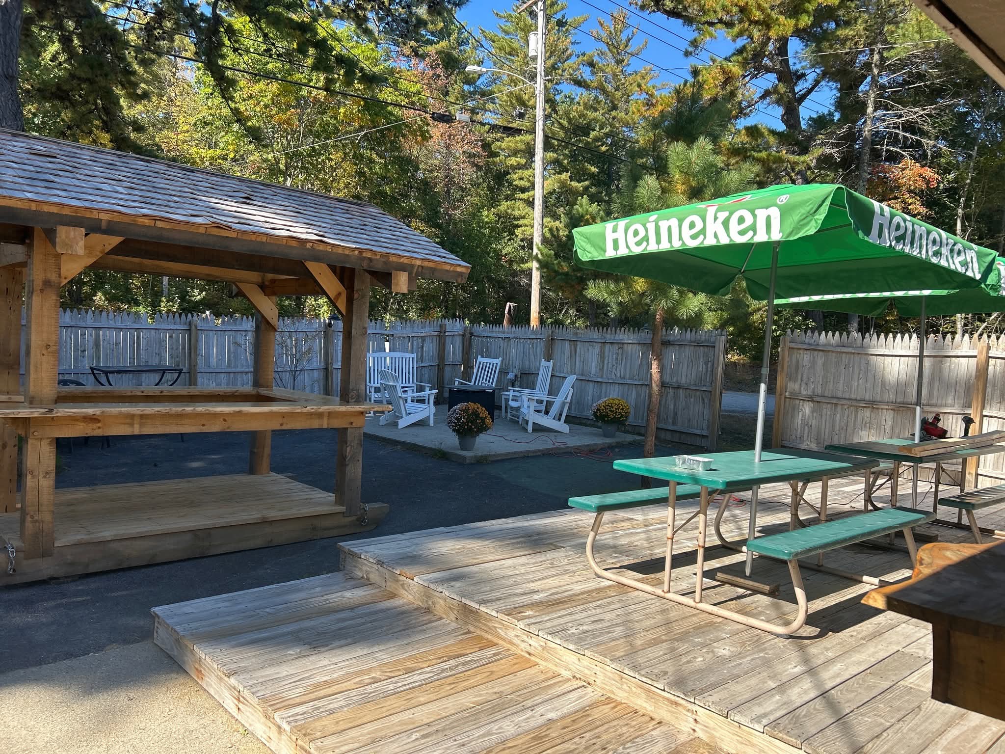 The Wooden Tavern outdoor deck, timber shelter, picnic tables and seating